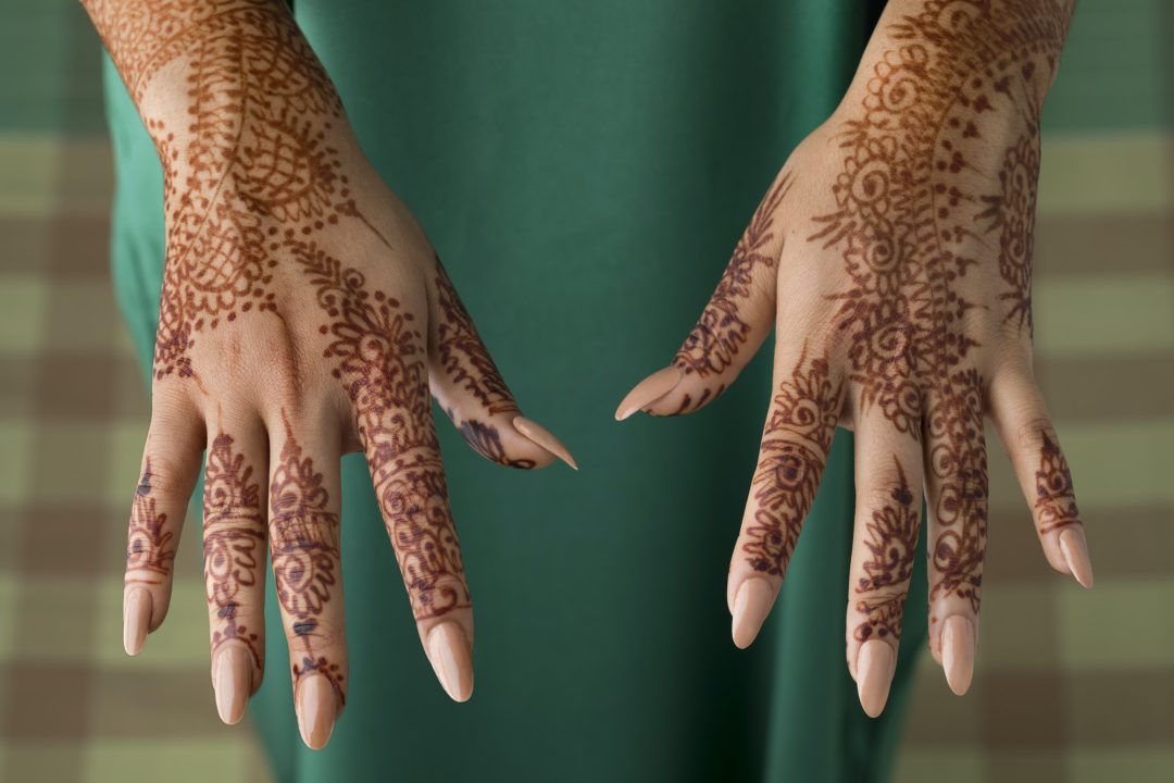 Moroccan woman with henna painted hands